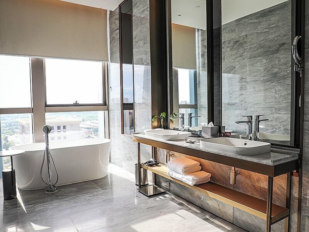 Imagen de la habitación del Hotel Wanda Jin Xiangjiang Dingzhou. Foto 15