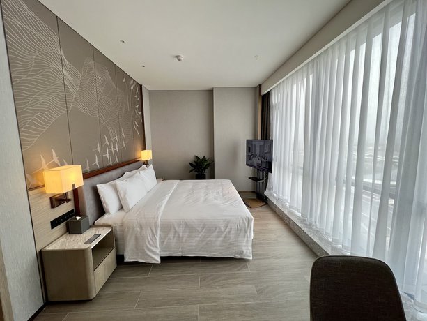 Imagen de la habitación del Hotel Wanda Jin Xiaohe Xincheng. Foto 5