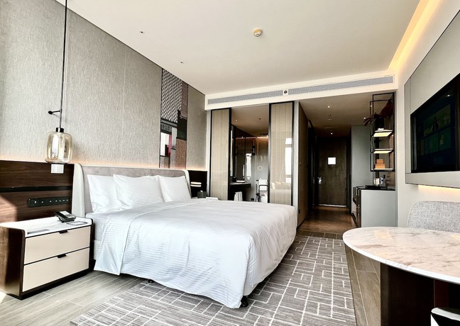 Imagen de la habitación del Hotel Wanda Jin Xiaohe Xincheng. Foto 17