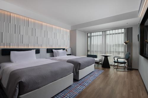 Imagen de la habitación del Hotel Wanda Moments Nanchang Xihu. Foto 16