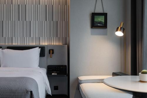 Imagen de la habitación del Hotel Wanda Moments Nanchang Xihu. Foto 17