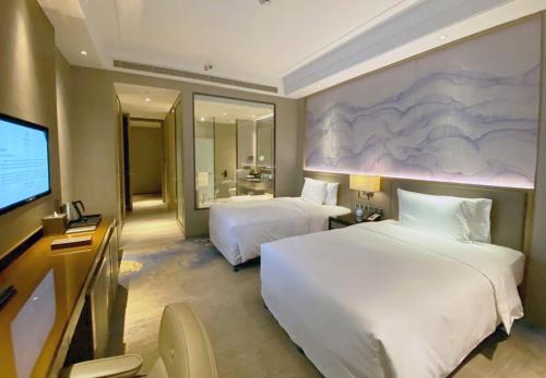 Imagen de la habitación del Hotel Wanda Realm Huangshi. Foto 9