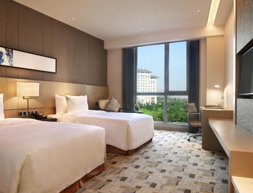 Imagen de la habitación del Hotel Wanda Realm Resort Nanchang. Foto 6