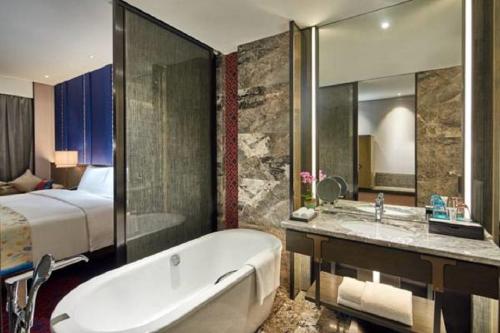 Imagen de la habitación del Hotel Wanda Realm Resort Nanning. Foto 5