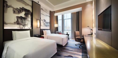 Imagen de la habitación del Hotel Wanda Realm Yiwu. Foto 5