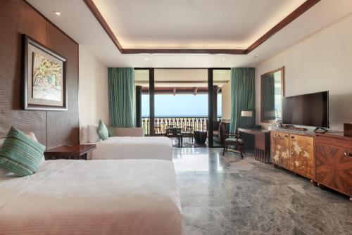 Imagen de la habitación del Hotel Wanda Vista Resort Sanya. Foto 10