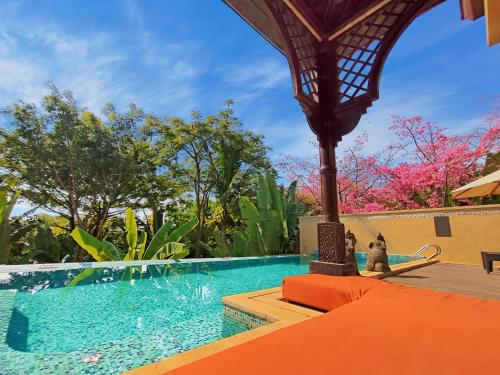 Imagen de la piscina del Hotel Wanda Vista Resort Xishuangbanna. Foto 13