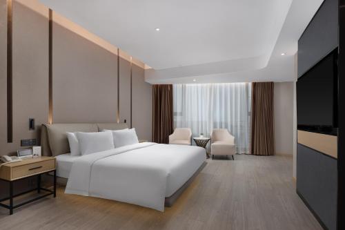Imagen de la habitación del Hotel Wanda Yue Suzhou Huangdai. Foto 17