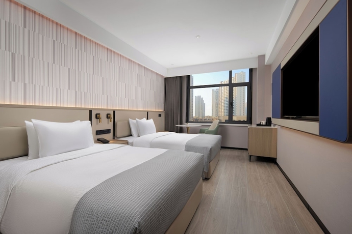Imagen de la habitación del Hotel Wanda Yuehua Tangshan North. Foto 2