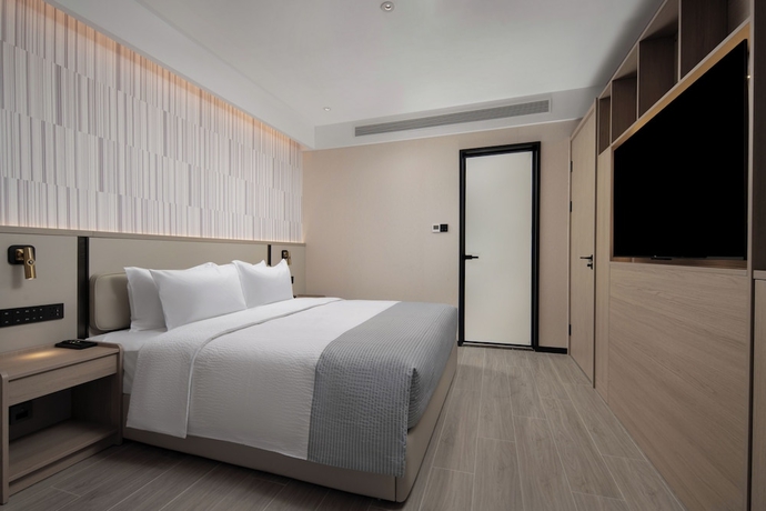 Imagen de la habitación del Hotel Wanda Yuehua Tangshan North. Foto 7