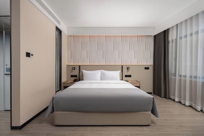 Imagen de la habitación del Hotel Wanda Yuehua Tangshan North. Foto 8