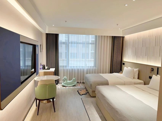 Imagen de la habitación del Hotel Wanda Yuehua Tangshan North. Foto 9