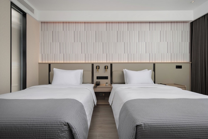 Imagen de la habitación del Hotel Wanda Yuehua Tangshan North. Foto 12