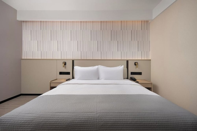 Imagen de la habitación del Hotel Wanda Yuehua Tangshan North. Foto 14
