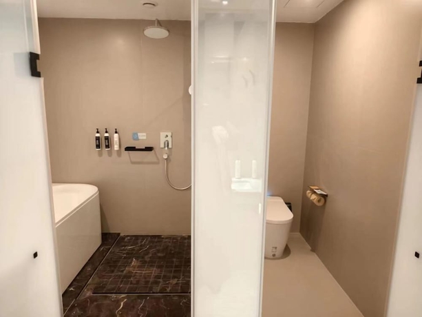 Imagen de la habitación del Hotel Wanda Yuehua Tangshan North. Foto 15