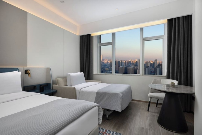 Imagen de la habitación del Hotel Wanda Yuehua Urumqi Railway. Foto 3
