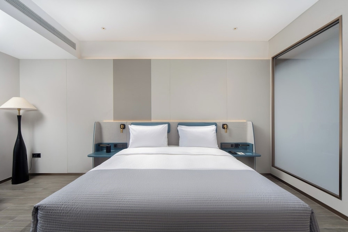 Imagen de la habitación del Hotel Wanda Yuehua Urumqi Railway. Foto 8