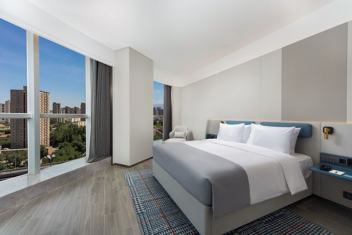 Imagen de la habitación del Hotel Wanda Yuehua Urumqi Railway. Foto 10