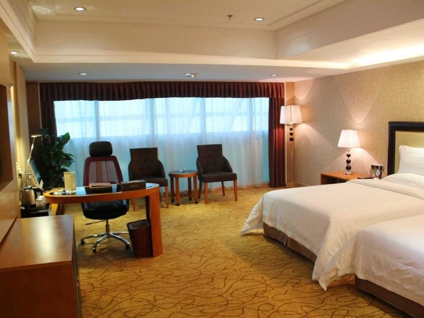Imagen de la habitación del Hotel Wanhua International. Foto 7