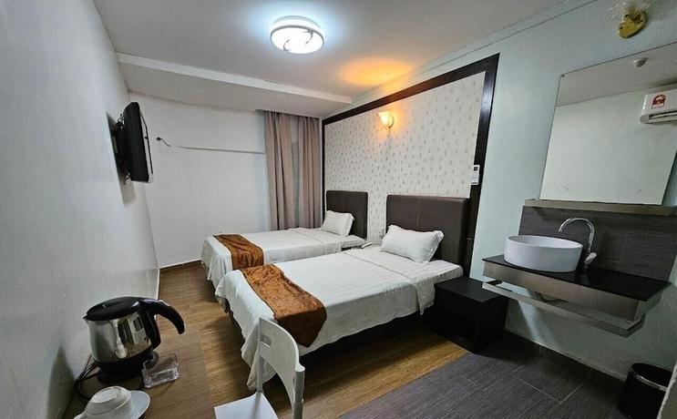 Imagen de la habitación del Hotel Warisan. Foto 11