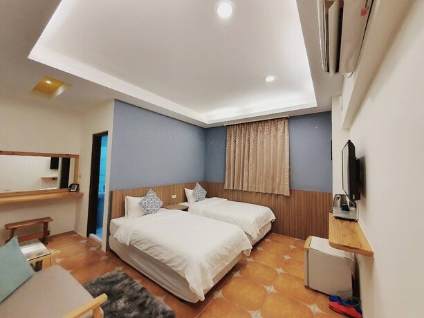 Imagen de la habitación del Hotel Warm and Cozy Inn. Foto 22