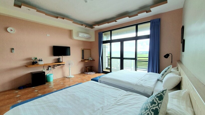 Imagen de la habitación del Hotel Warm and Cozy Inn. Foto 23