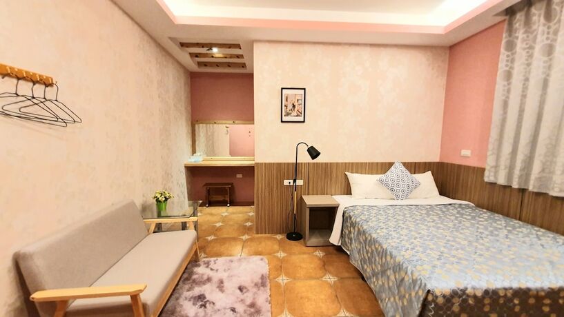 Imagen de la habitación del Hotel Warm and Cozy Inn. Foto 25