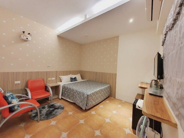 Imagen de la habitación del Hotel Warm and Cozy Inn. Foto 34