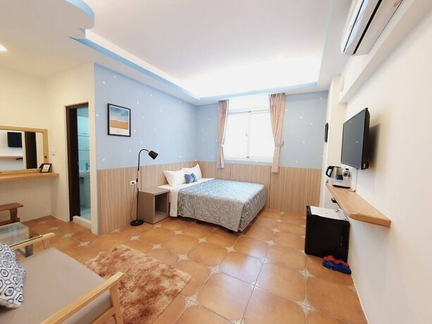 Imagen de la habitación del Hotel Warm and Cozy Inn. Foto 36