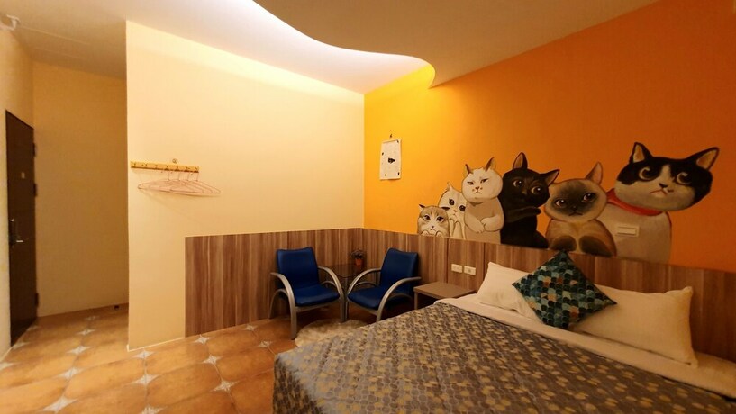 Imagen de la habitación del Hotel Warm and Cozy Inn. Foto 39