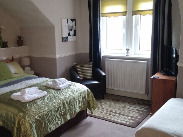 Imagen de la habitación del Hotel Warwick Lodge Guesthouse. Foto 13