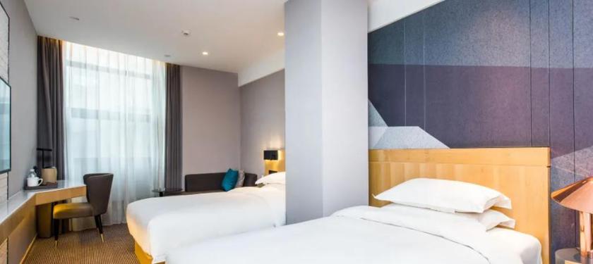 Imagen de la habitación del Hotel Wassim R Hotel (Suzhou Shantang Street Shilu Metro Station). Foto 6