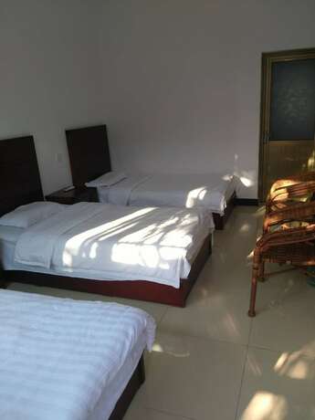 Imagen de la habitación del Hotel Water Great Wall Heshi Mountain House. Foto 19