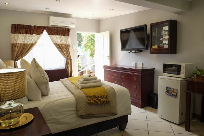 Imagen de la habitación del Hotel Waterkloof Guest House. Foto 12