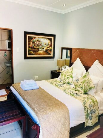 Imagen de la habitación del Hotel Waterkloof Guest House. Foto 18