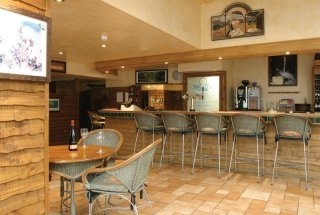 Imagen del bar/restaurante del Hotel Waterwheel Inn Hotel. Foto 3