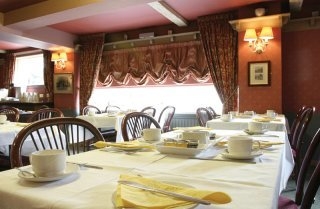 Imagen del bar/restaurante del Hotel Waterwheel Inn Hotel. Foto 4