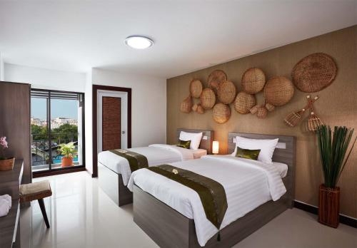 Imagen de la habitación del Hotel Wattana Place. Foto 9