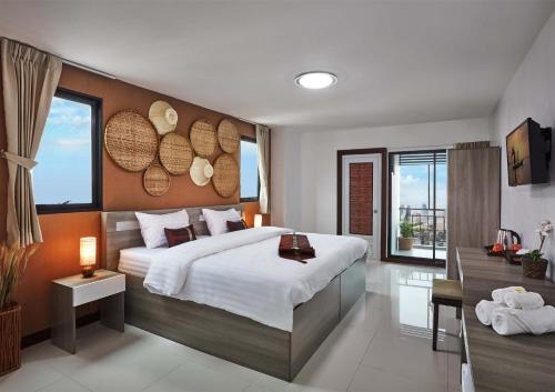 Imagen de la habitación del Hotel Wattana Place. Foto 10