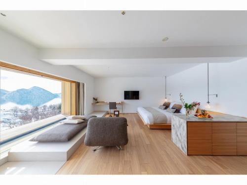 Imagen de la habitación del Hotel We Toya. Foto 6