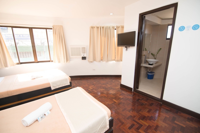 Imagen de la habitación del Hotel We Travelers Inn. Foto 12
