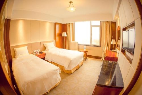 Imagen de la habitación del Hotel Weihai Golden Bay Resort Hotel. Foto 4