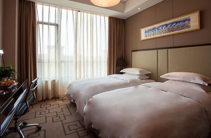 Imagen de la habitación del Hotel Weihai Guishe Fourseasons. Foto 5
