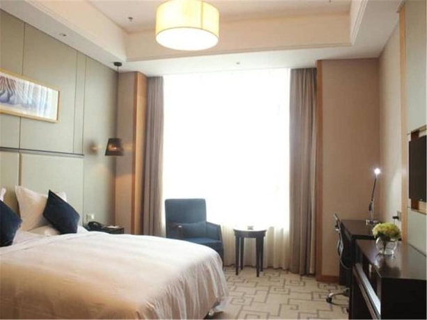 Imagen de la habitación del Hotel Weihai Guishe Fourseasons. Foto 9
