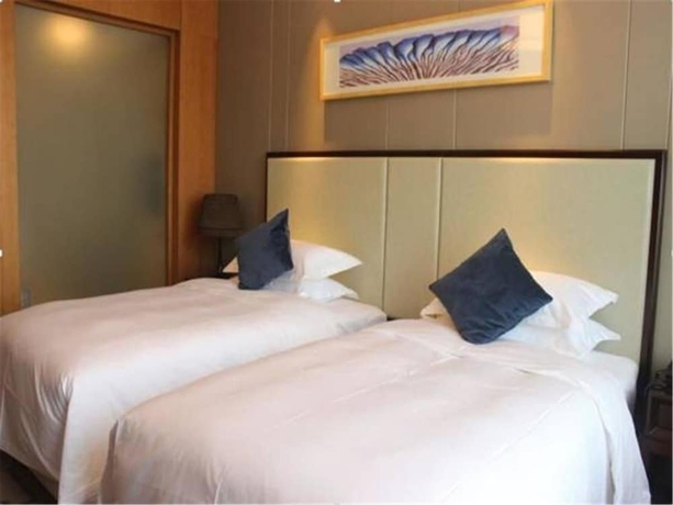 Imagen de la habitación del Hotel Weihai Guishe Fourseasons. Foto 10