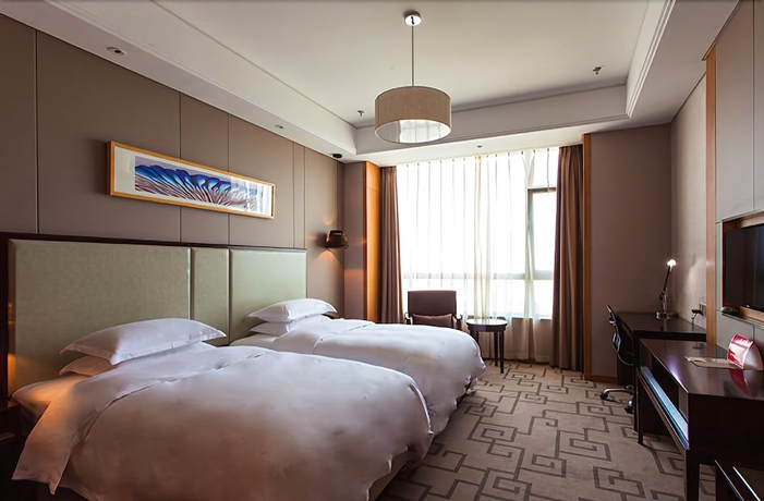 Imagen de la habitación del Hotel Weihai Guishe Fourseasons. Foto 11