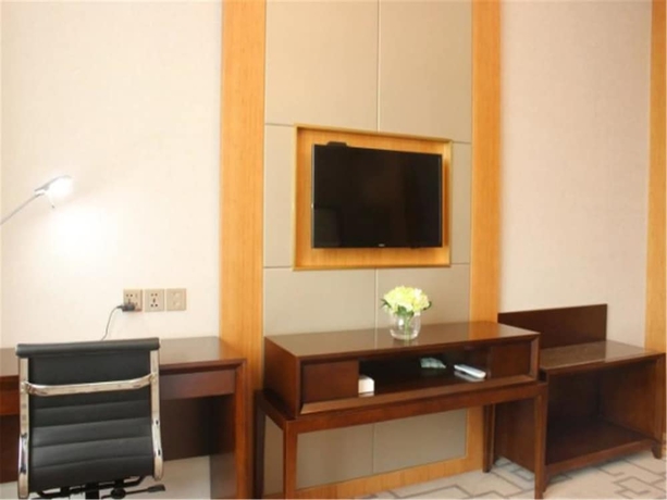 Imagen de la habitación del Hotel Weihai Guishe Fourseasons. Foto 12