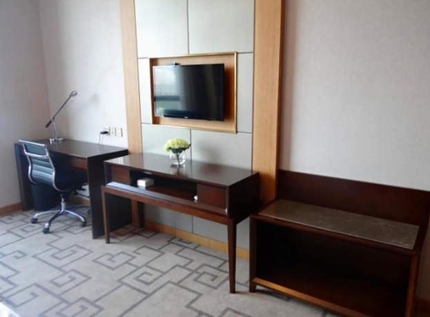 Imagen de la habitación del Hotel Weihai Guishe Fourseasons. Foto 13