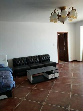 Imagen de la habitación del Hotel Weihai Haina Holiday Apartment. Foto 14