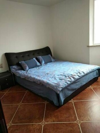 Imagen de la habitación del Hotel Weihai Haina Holiday Apartment. Foto 15